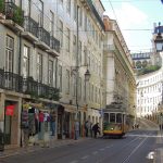Historic Tram 28 on a street in Lisbon