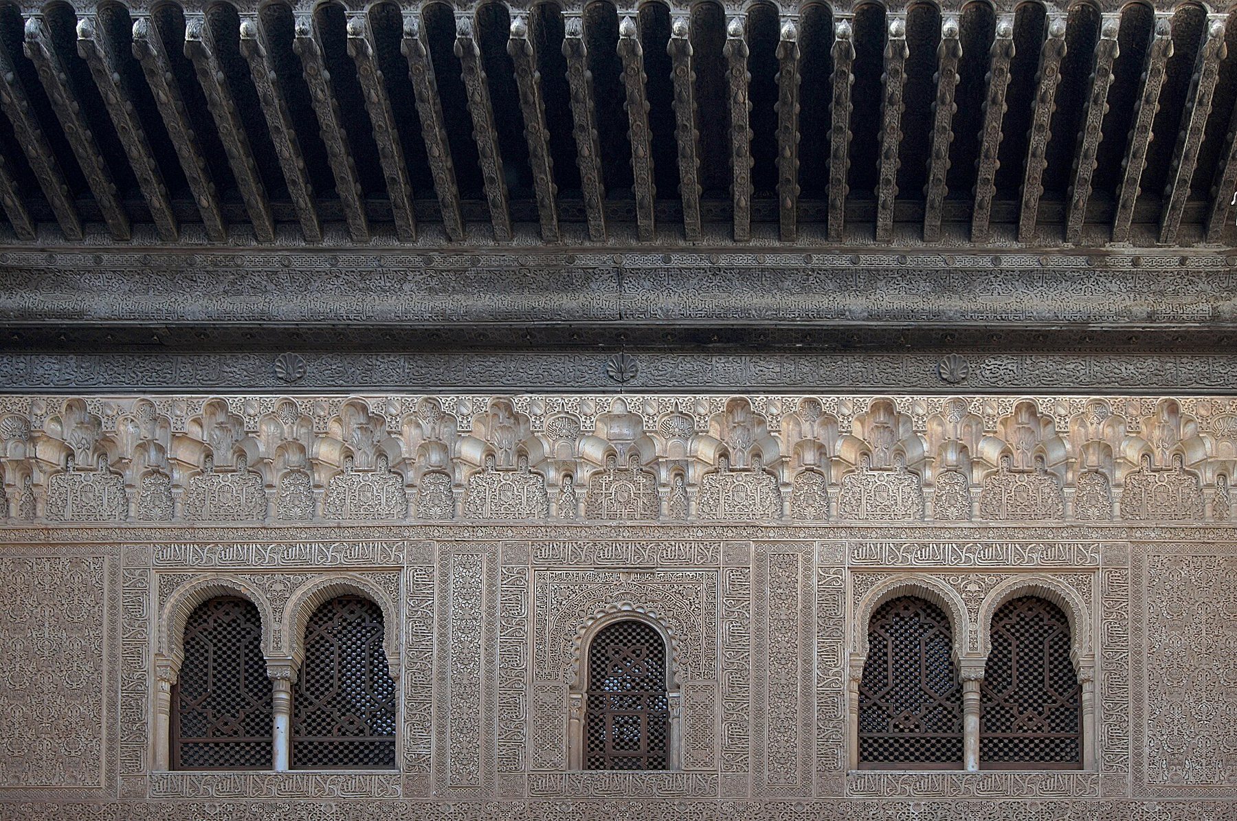 Ornate arches and courtyard inside the Nasrid Palaces at the Alhambra