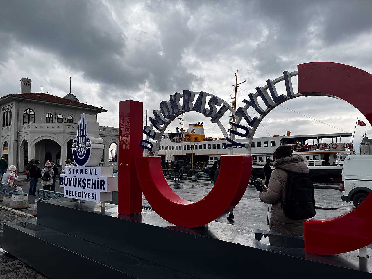 Kadıköy ferry terminal entrance with a city ferry behind it