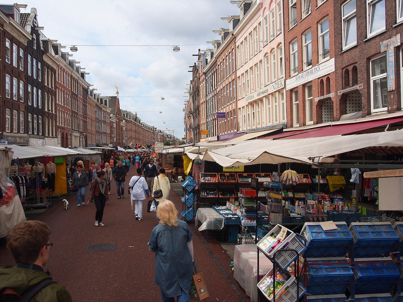 Shoppers walking between stalls at Albert Cuyp Market in De Pijp, Amsterdam