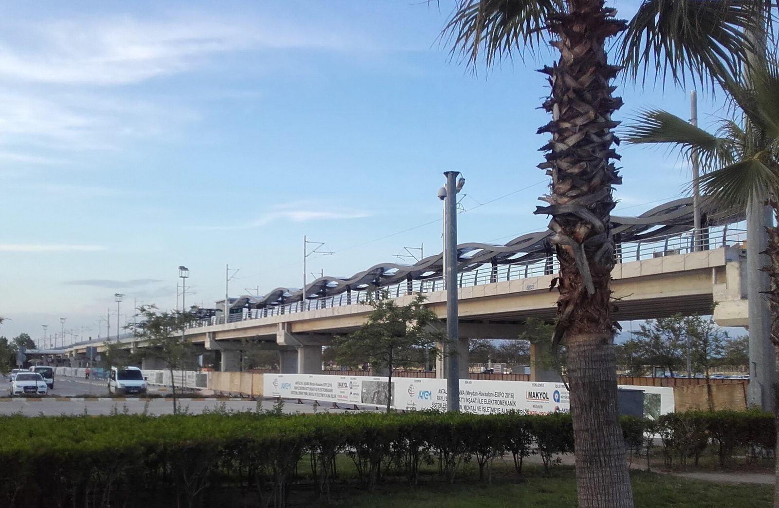 Elevated AntRay tram station beside the road at Antalya Airport