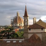 Brunelleschi’s red-tiled dome rising above Florence at sunset