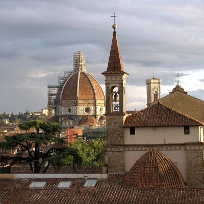 Brunelleschi’s red-tiled dome rising above Florence at sunset