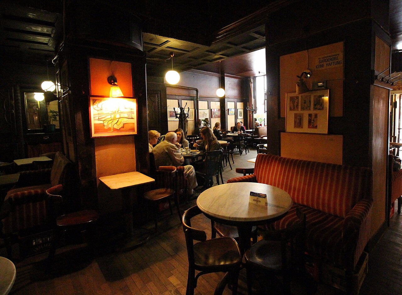 Dark wood interior and seating inside Café Hawelka in Vienna
