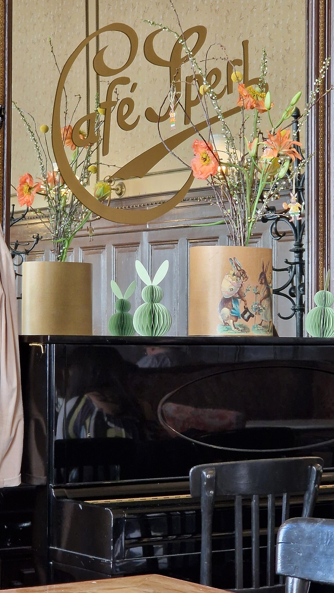 Café Sperl mirror, piano and floral display in Vienna