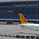Panoramic view of Zurich Airport terminal and aircraft