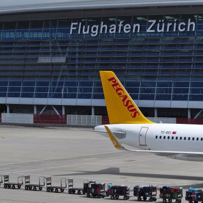 Panoramic view of Zurich Airport terminal and aircraft